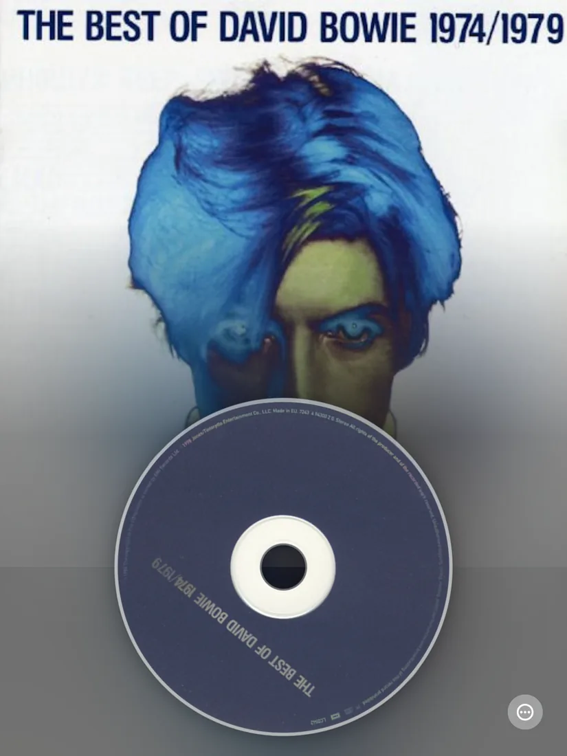 MusicCovered Mobile album artwork and CD player with David Bowie on iPad in portrait
